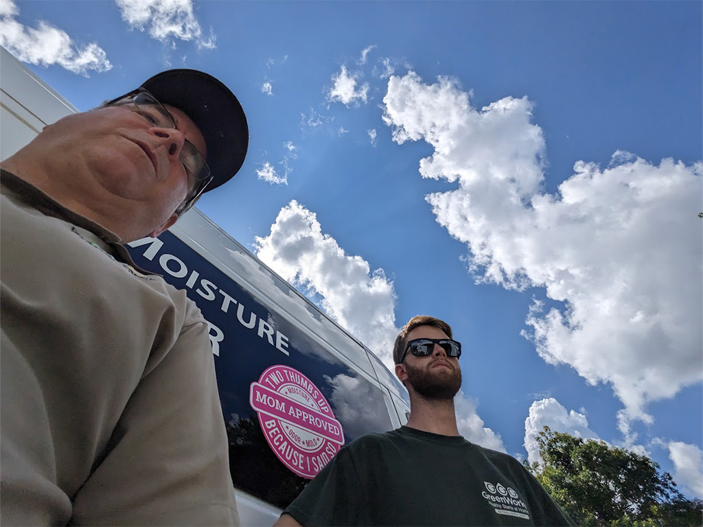 Selfie of two men standing outdoors