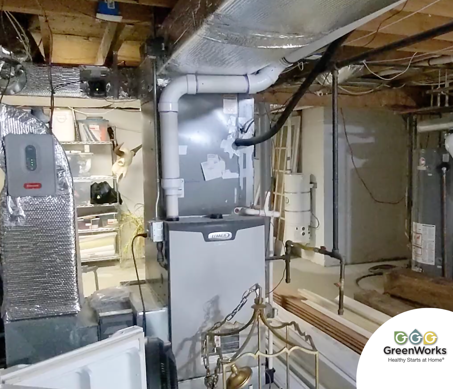 Basement With Exposed Pipes And Furnace, Surrounded By Various Tools And Shelves. It Appears Orderly, Conveying A Functional And Utilitarian Tone. Basement with exposed pipes and furnace, surrounded by various tools and shelves. It appears orderly, conveying a functional and utilitarian tone.